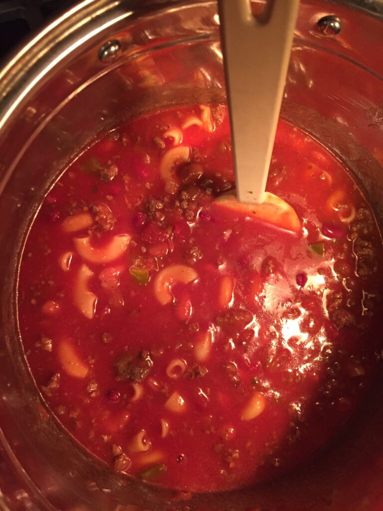 mixing the chili ingredients in the pot