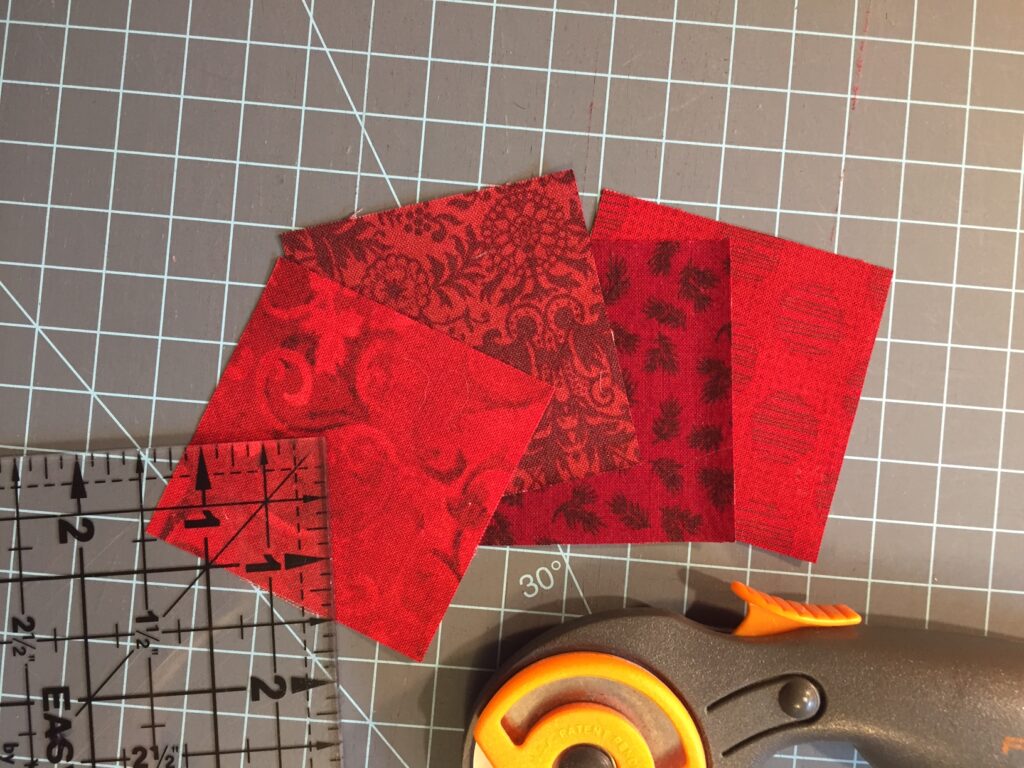 four red fabric squares