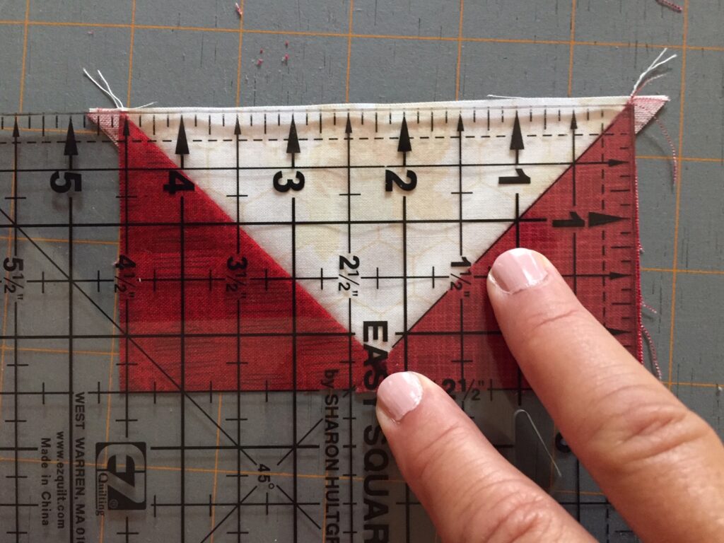 lining up seams on the ruler to trim the Easy No Waste Flying Geese