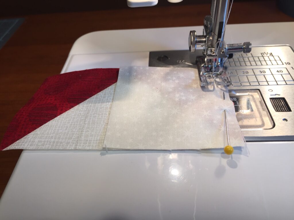 sewing corner square onto flying geese block