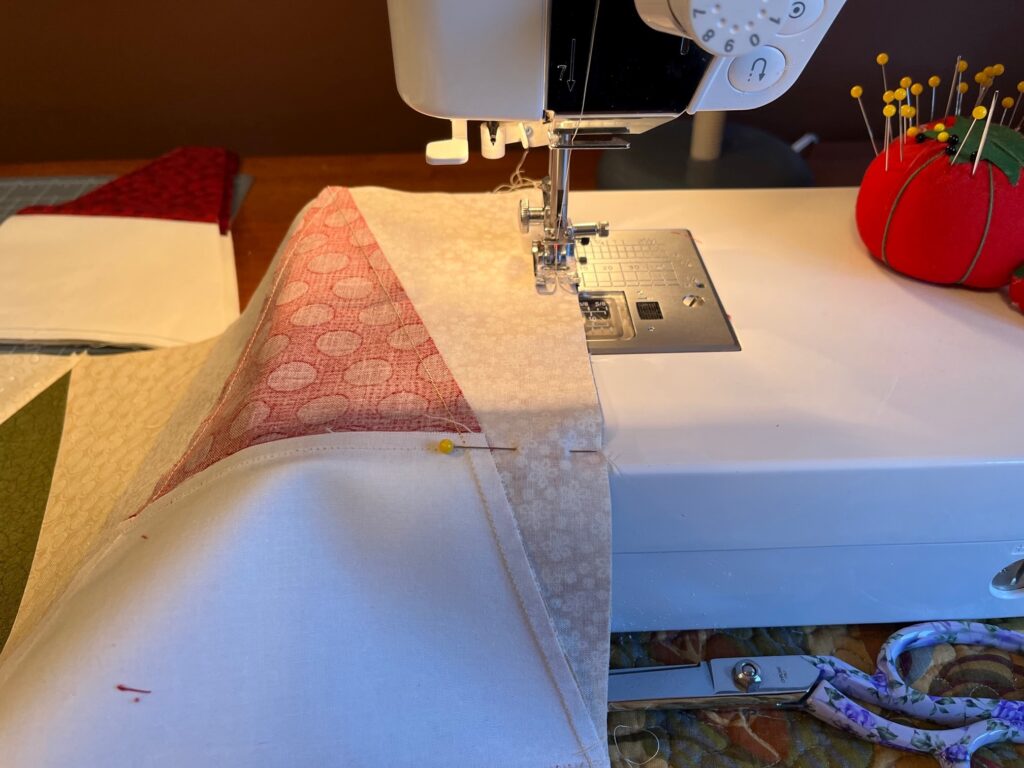 sewing blocks together for the balsam gnomes table runner quilt