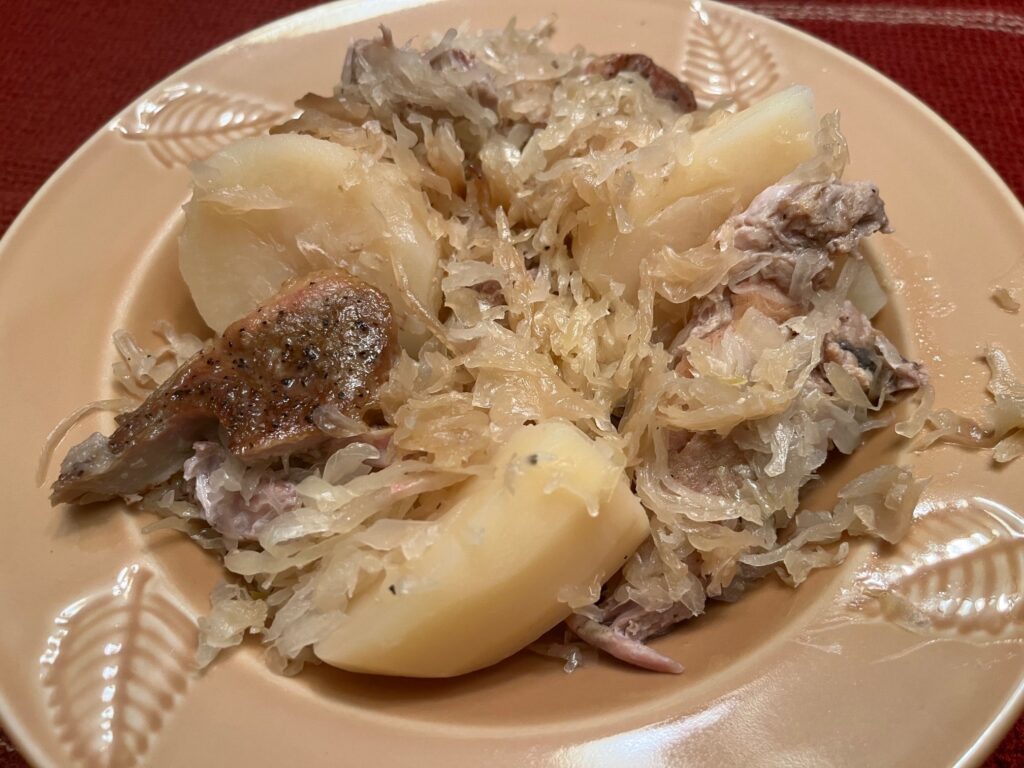serving of sauerkraut and pork chops