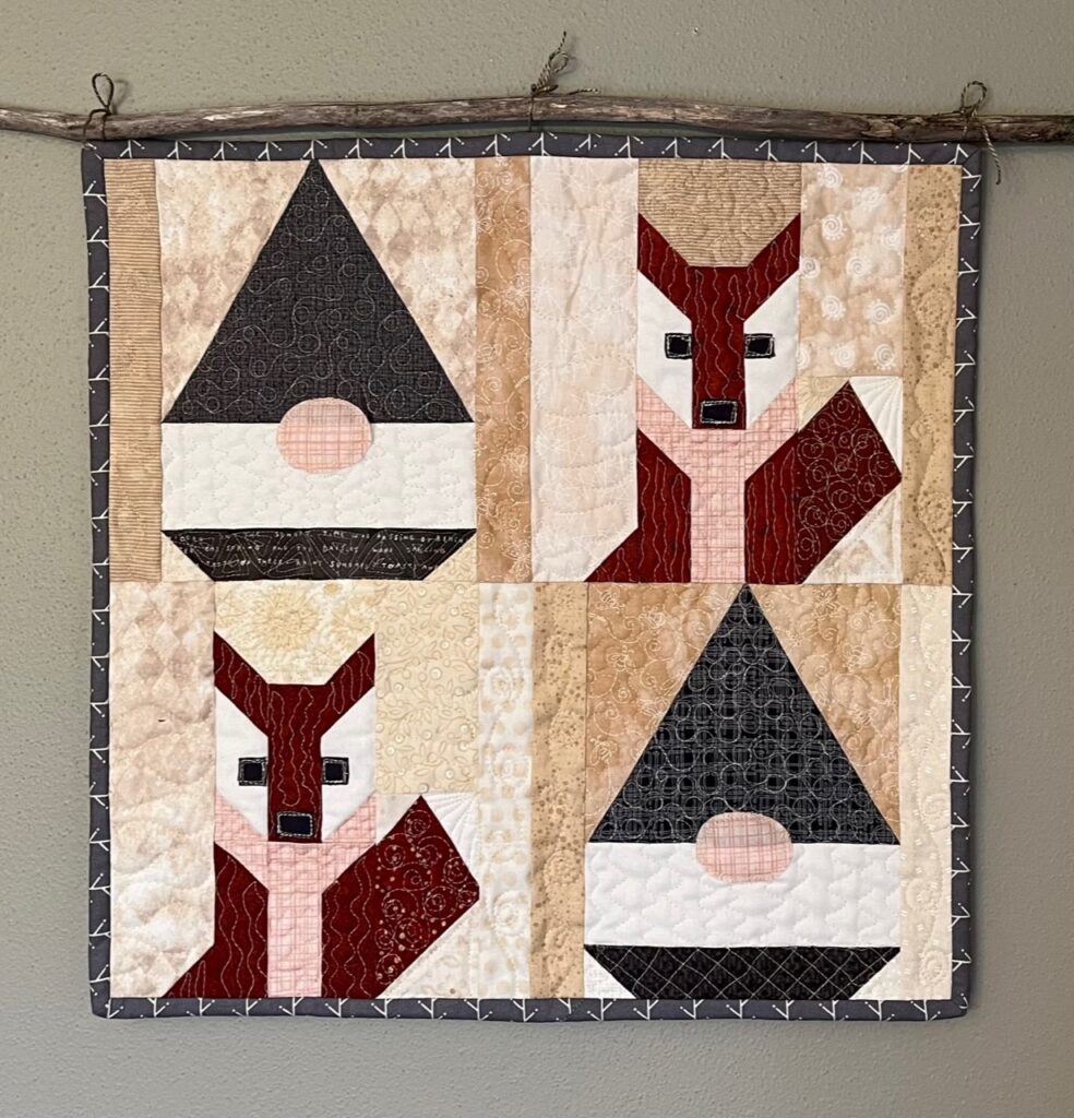 "Foxy Gnomes Quilt" is a Free Gnome Christmas Quilt Pattern from Lake Girl Quilts!